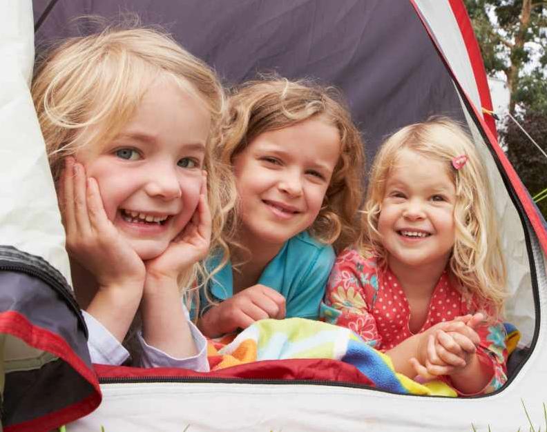 Little girls enjoy their temperate north american camping experience