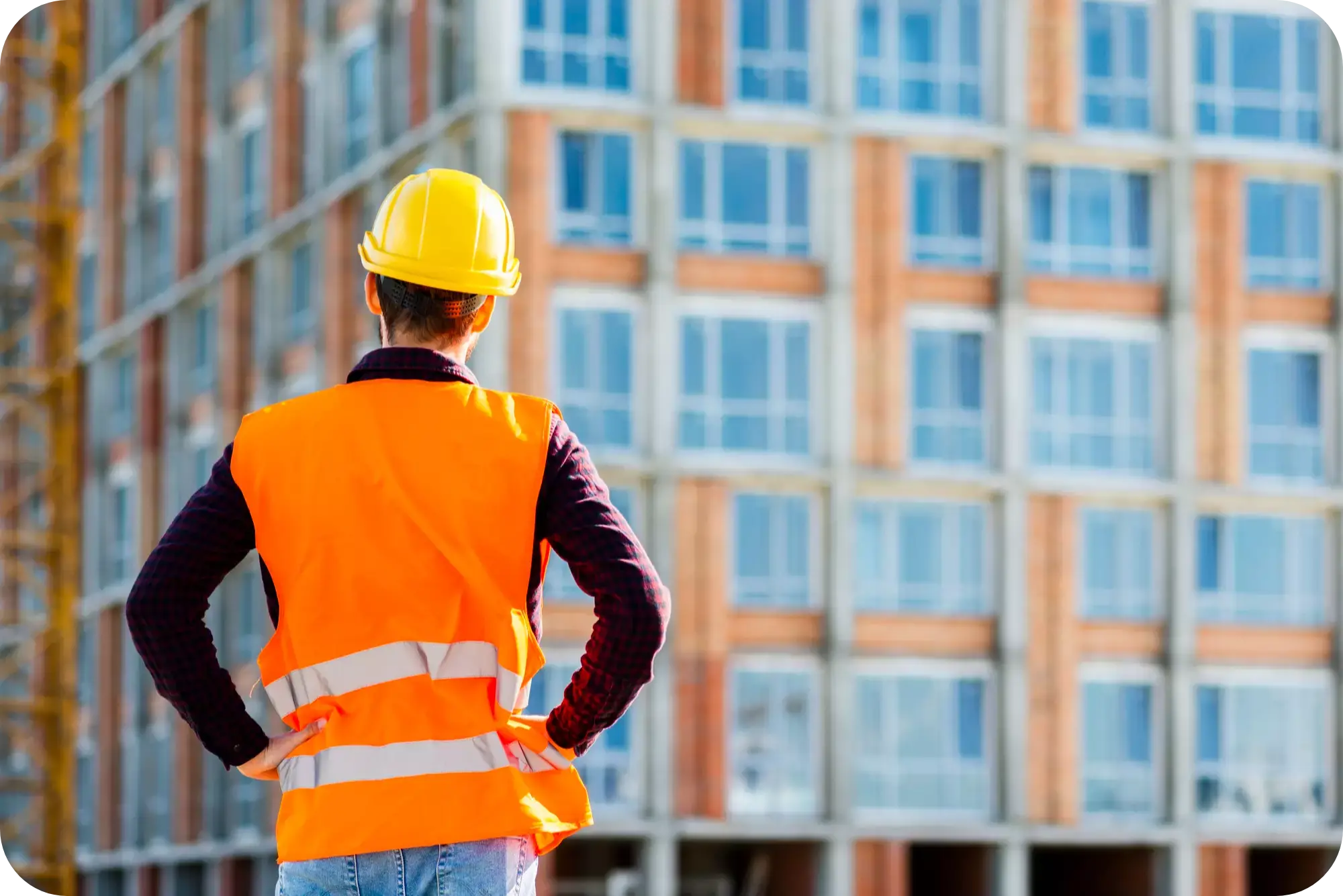 A Construction Worker standing in front of a site.