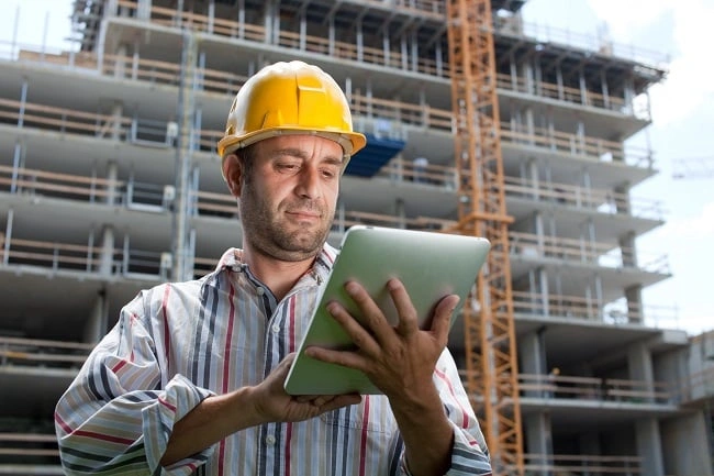 construction worker with a tablet