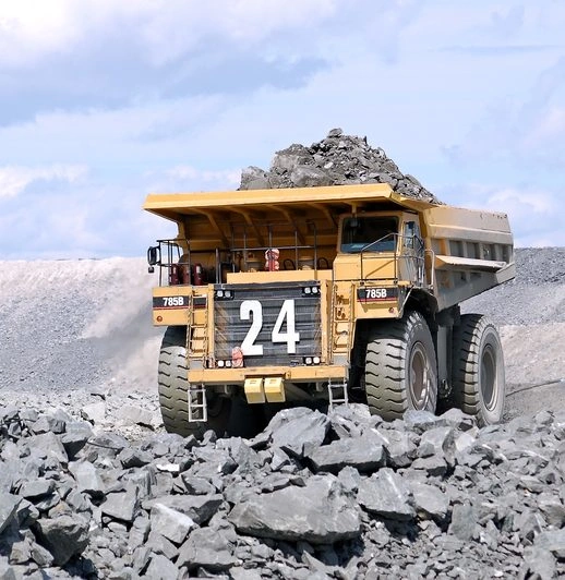 Choosing an LMS gears towards safety in industries such as construction, oil and gas, transportation, and mining. A Mega truck carrying load of rocks at a mining site